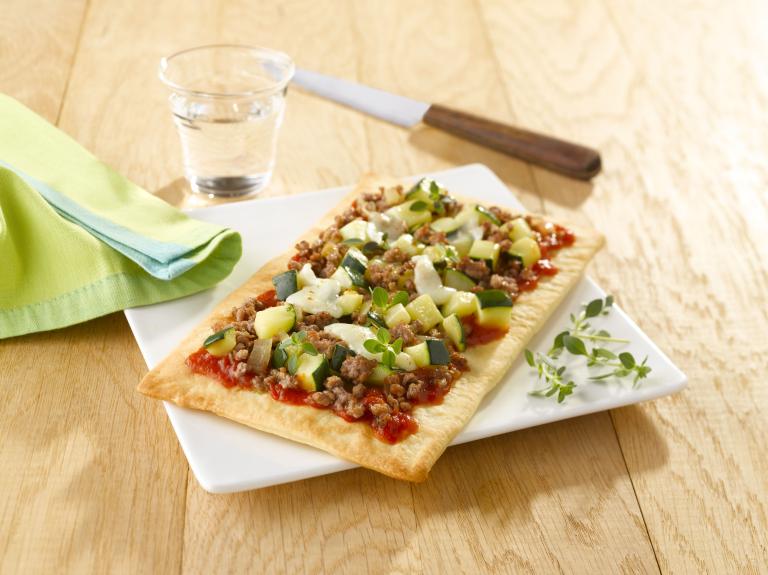 Pizza avec pâte à la courgette pour 4 personnes - Recettes - Elle à Table